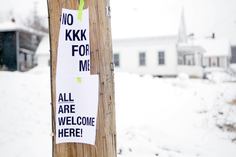 These signs hang on a utility pole on Wednesday at the corner of Cumberland and Washington streets in Augusta.