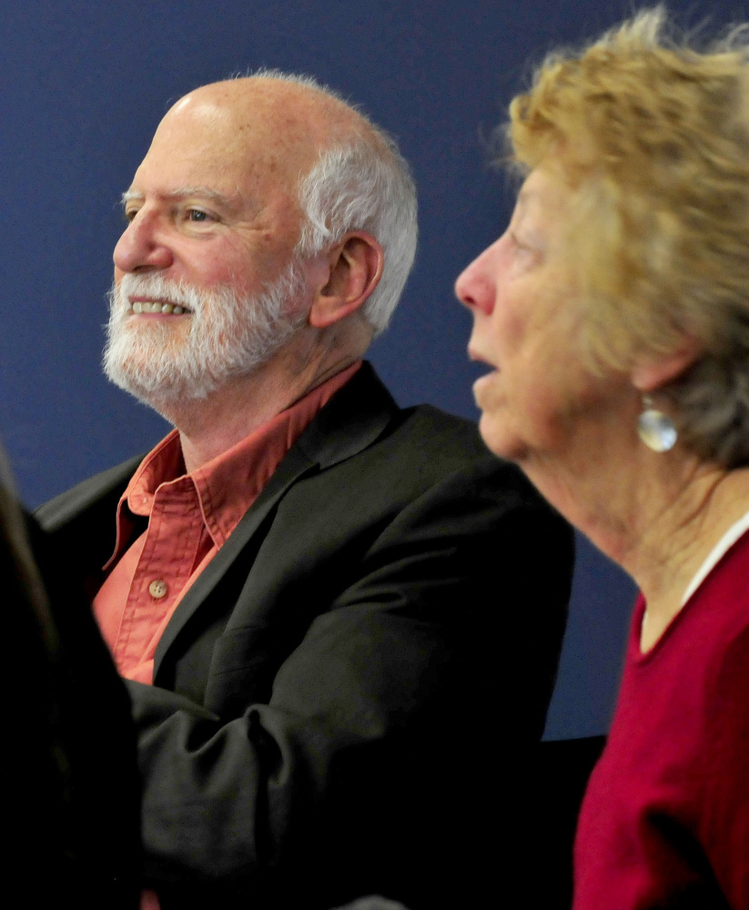 Artist Robert Shetterly speaks to Thomas College students Thursday about promoting and recognizing people who make a positive contribution to society. At right is Connie Carter, who is involved in the Samantha Smith Challenge.