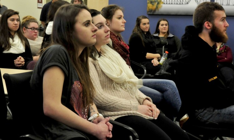 Thomas College students listen Thursday to artist Robert Shetterly, who spoke about promoting and recognizing people who make a positive contribution to society.