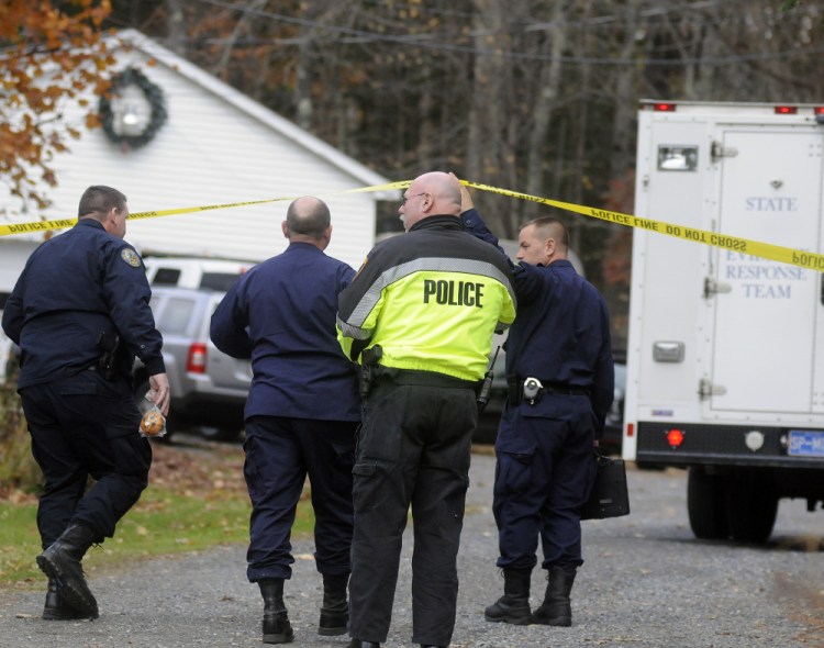 Maine State Police detectives enter the driveway Oct. 31, 2016, at a home in Winthrop where the bodies of Antonio and Alice Balcer were found early in the morning.