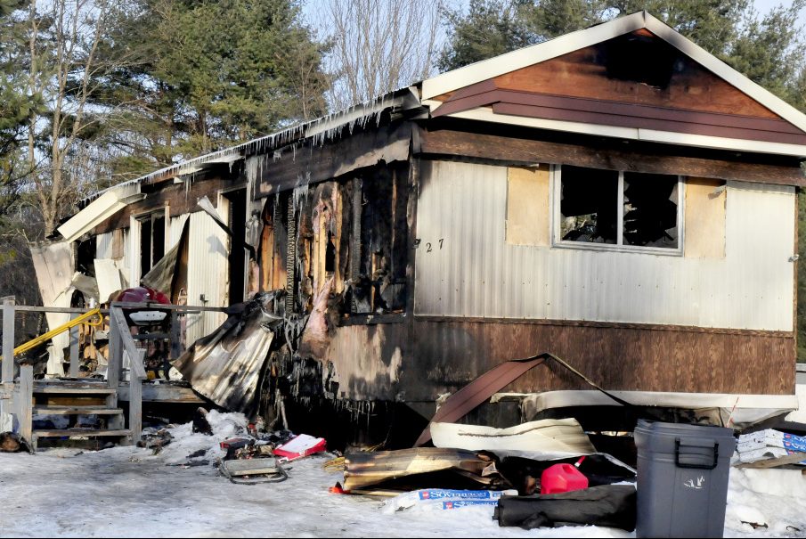 The remains of a mobile home and its contents litter the home site on the Browns Corner Road in Canaan on Sunday. The home was destroyed by fire on Saturday afternoon. Owner Laura Dudley escaped the home and a cat was report missing.