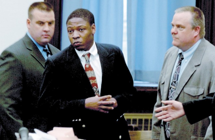 Daniel L. Fortune, center, is escorted by deputies into the Somerset County Superior Court in Skowhegan on the first day of his trial in 2010.