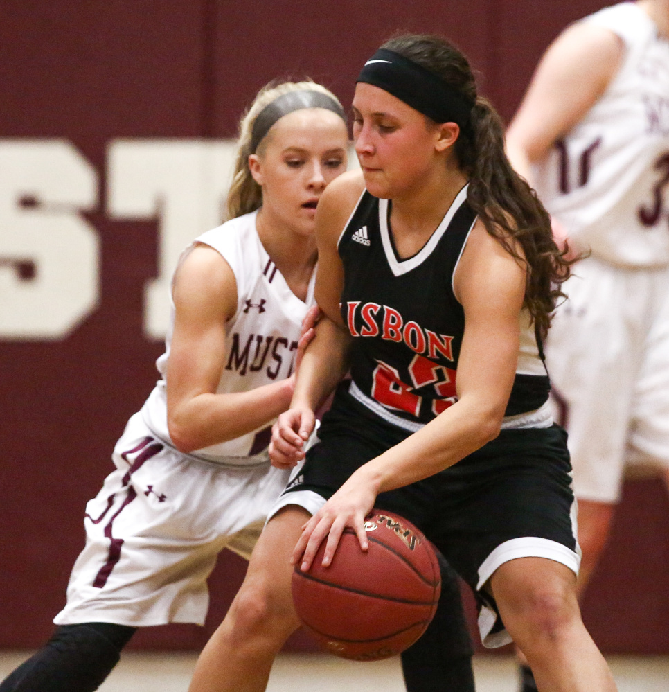 Lisbon's Giana Russo tries to get past a Monmouth defender during the first half of a game Monday night in Monmouth.