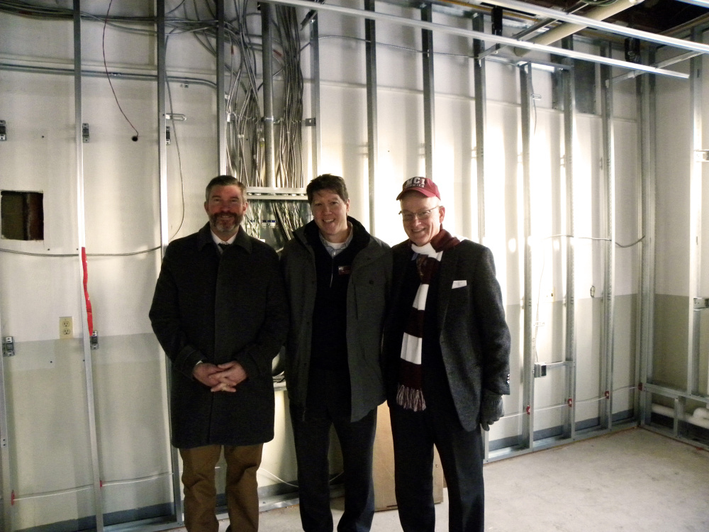 From left, Maine Central Institute Headmaster Chris Hopkins, Maine Central Institite board of trustees President Norbert W. Young Jr. and MCI trustee Timothy Archibald tour a renovation site Feb. 3 in JR Cianchette Hall with other members of the board of trustees.