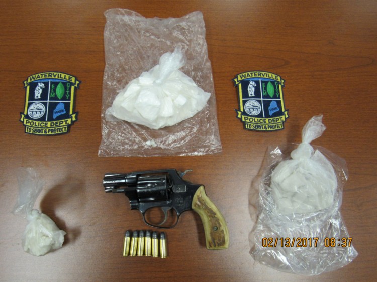 Drugs and a gun seized by Waterville police during a search of an apartment on College Avenue on Friday.