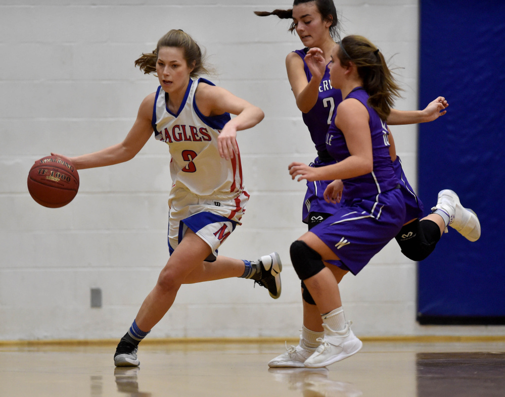 Messalonskee senior guard Sophie Holmes (3) dribbles the ball down the court as Waterville defenders give chase during a Kennebec Valley Athletic Conference Class A game earlier this season in Oakland.