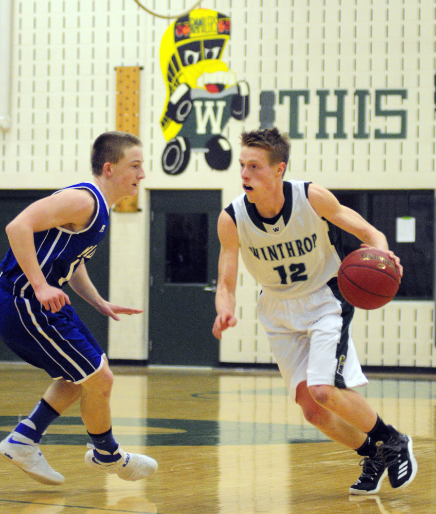 Winthrop senior Jacob Hickey looks to make a move on Madison defender Evan Bess during a Mountain Valley Conference game earlier this season in Winthrop.