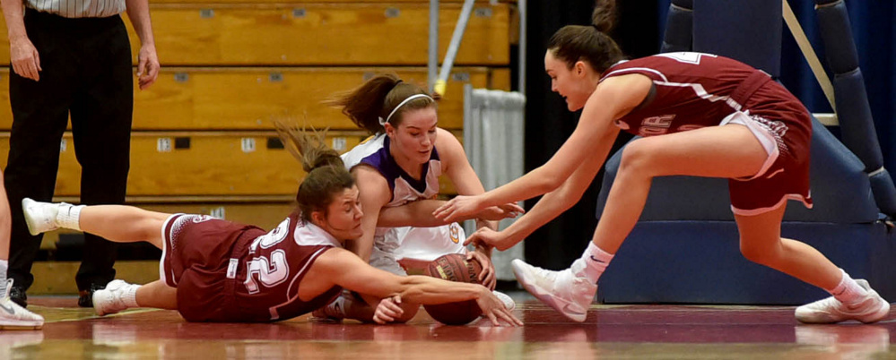 Staff photo by Michael G. Seamans 
 Bangor's Kira Yardley, left, dives for the loose ball as Cheverus' Kaylin Malmquist, center, and Bangor's Katie Butler battles for a loose ball during a Class AA North quarterfinal Thursday at the Augusta Civic Center.