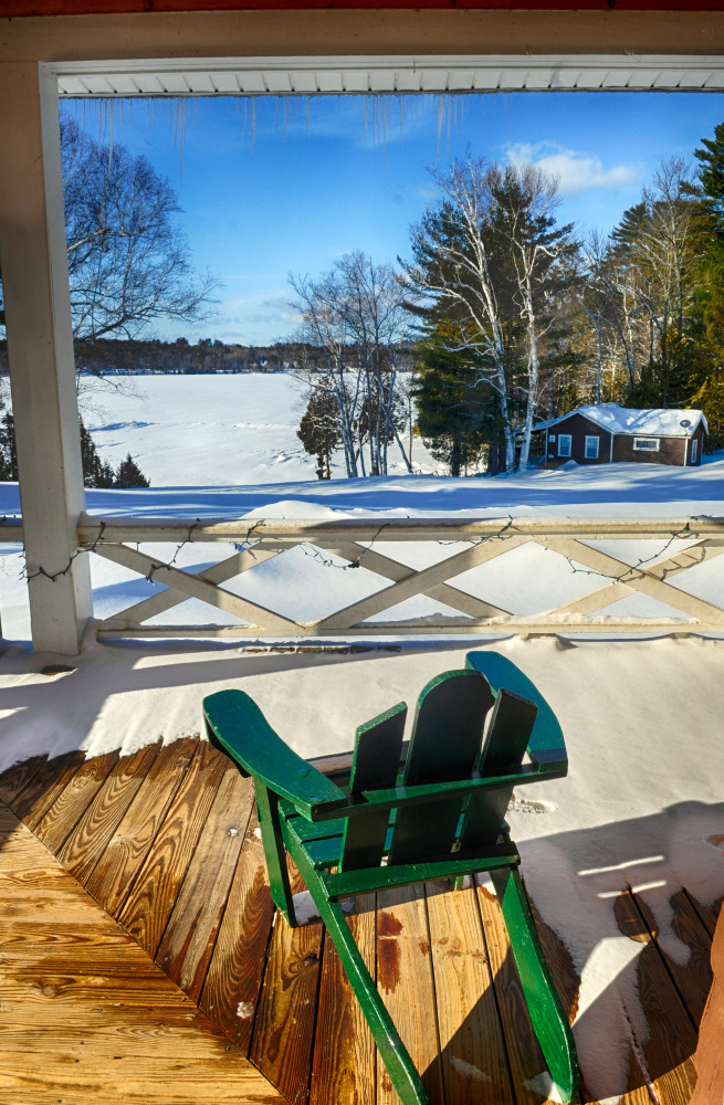 The view from the porch of lodge at Snow Pond Center for the Arts is seen Thursday. Christa Johnson, director of development at the center, said that the porch overlooking the lake is usually where a bar is set up for events.