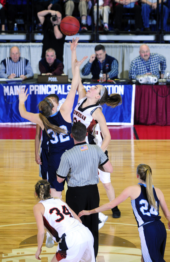 Oceanside's Alexis Mazurek, left, and Skowhegan's Annie Cooke battle for a rebound during a Class A North quarterfinal game Friday at the Augusta Civic Center.