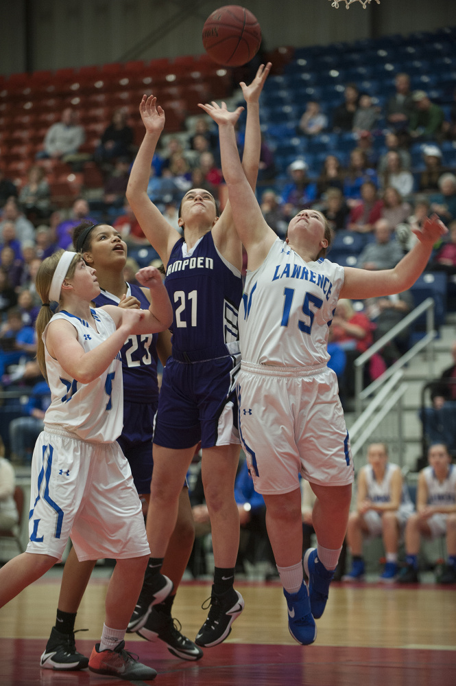 Lawrence's Morgan Boudreau and Hampden's Brooklyn Scott battle for a rebound during a Class A North quarte final game Friday at the Augusta Civic Center. Lawrence's Brooklyn Lambert and Hampden's Bailey Donovan look on at left.