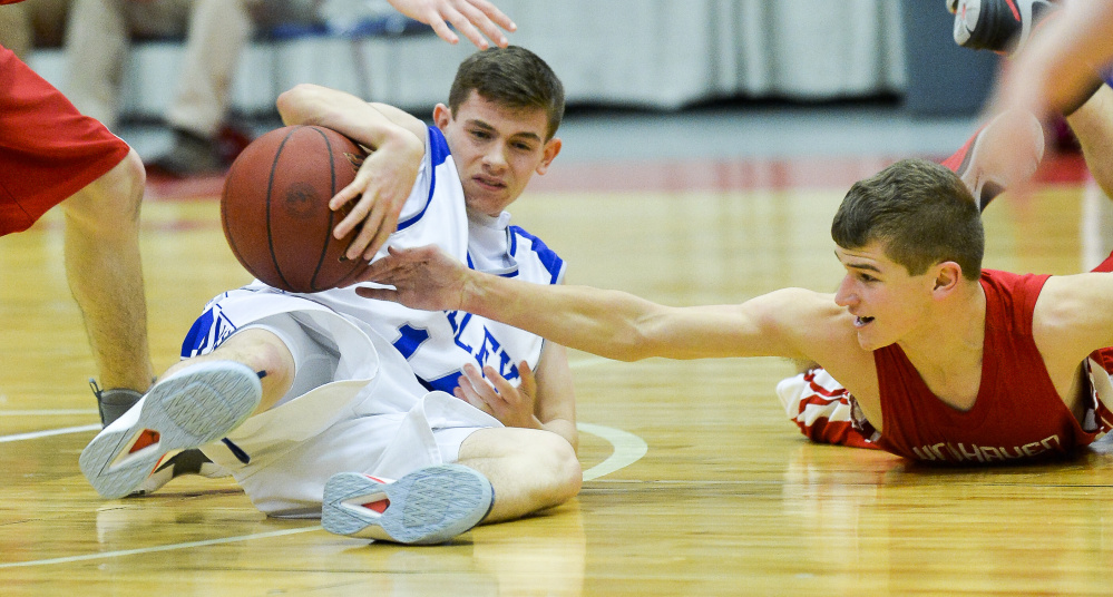 Valley sophomore Joey Thomas tries to keep the ball away from Vinalhaven defender Max Stanley in a scuffle over the ball in the second half of a Class D South quarterfinal Saturday in Augusta.