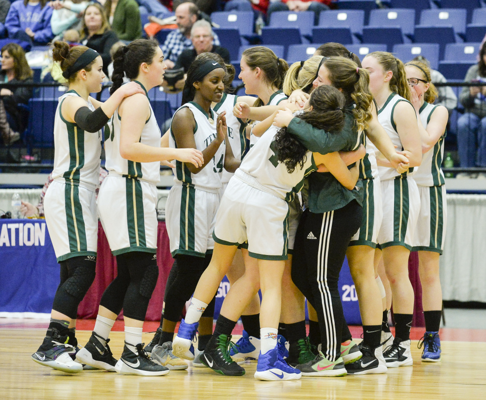 The Temple girls basketball team celebrates a hard-fought 42-40 victory over Greenville in a D South quarterfinal game Saturday morning at the Augusta Civic Center.