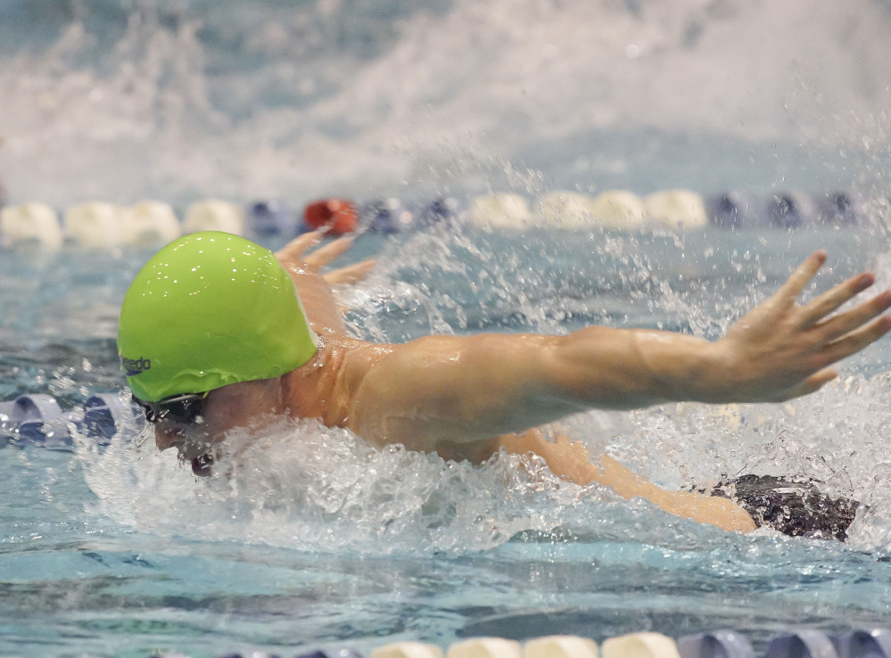 Old Town swimmer Noah Burr swims the butterfly leg of the 200 medley relay during the Class B state swimming and diving championships Saturday at Wallace Pool in Orono.
