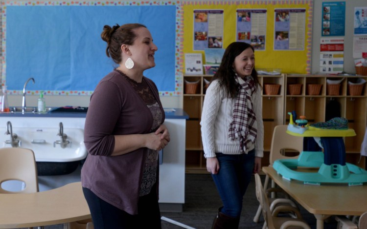 Jessica Powell, project director of the Kennebec Valley Community College Early Childhood Discovery Groups at the new Alfond Campus, discusses aspects of the programs goals. Emma Downing, right, a practicum student teacher, also helps with activities as part of her degree requirements.
