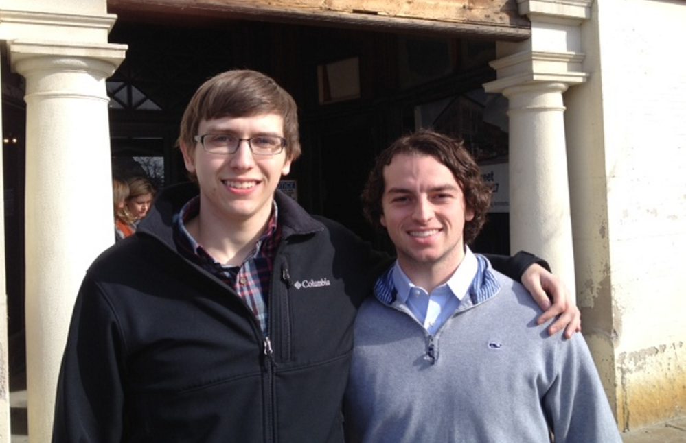 Colby sophomores Austin Nantkes, 19, of Lincoln, left, and Rob Durst, 21, of Dublin, California, stand outside the former Hains building Tuesday in downtown Waterville after attending the announcement of the new Alfond Leaders program.