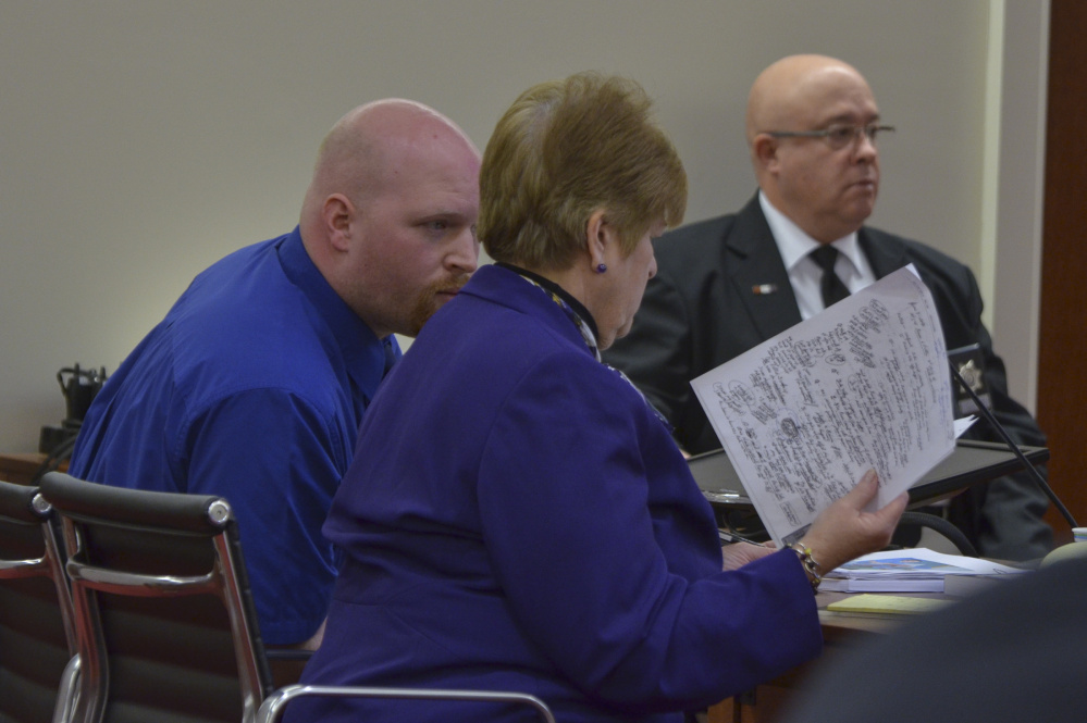 Lucas Savage, left, formerly of Clinton, confers Tuesday with his attorney, Pamela Ames, during the opening day of Savage's trial. Savage is a former co-director at a youth ministry program in Canaan and is on trial on one count of unlawful sexual contact.