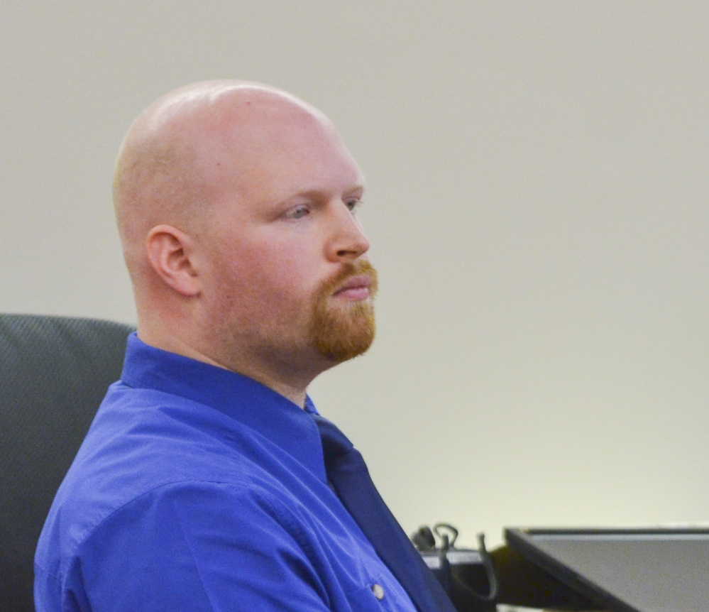 Lucas Savage, 28, of Clinton, listens Tuesday during his trial on a charge of unlawful sexual contact with a 10-year-old girl.
