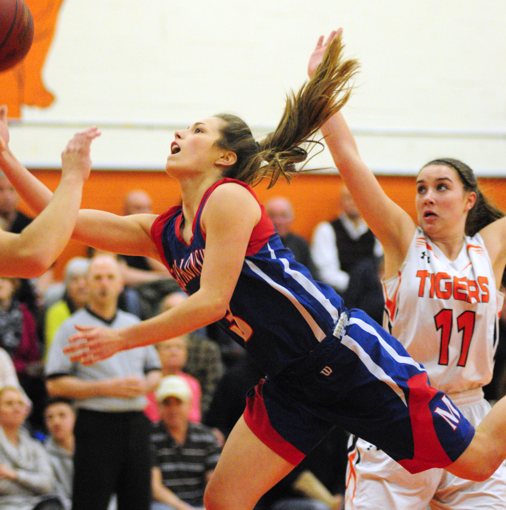 Messalonskee guard Sophie Holmes shoots around Gardiner's Leslie Stevens  during a game earlier this season in Gardiner.