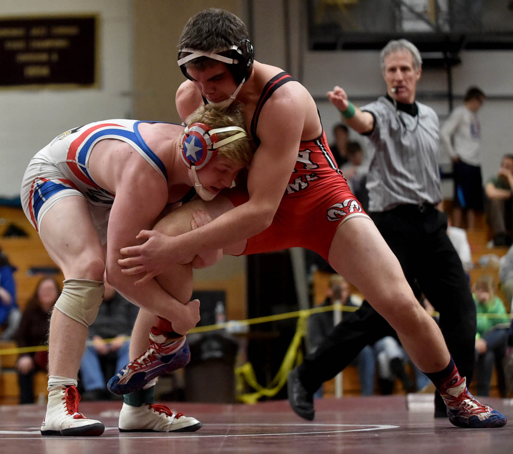 Cony sophomore Nic Mills, right, wrestles Messalonskee's Austin Pelletier in the 182-pound match at the Class A North wrestling championships earlier this season.