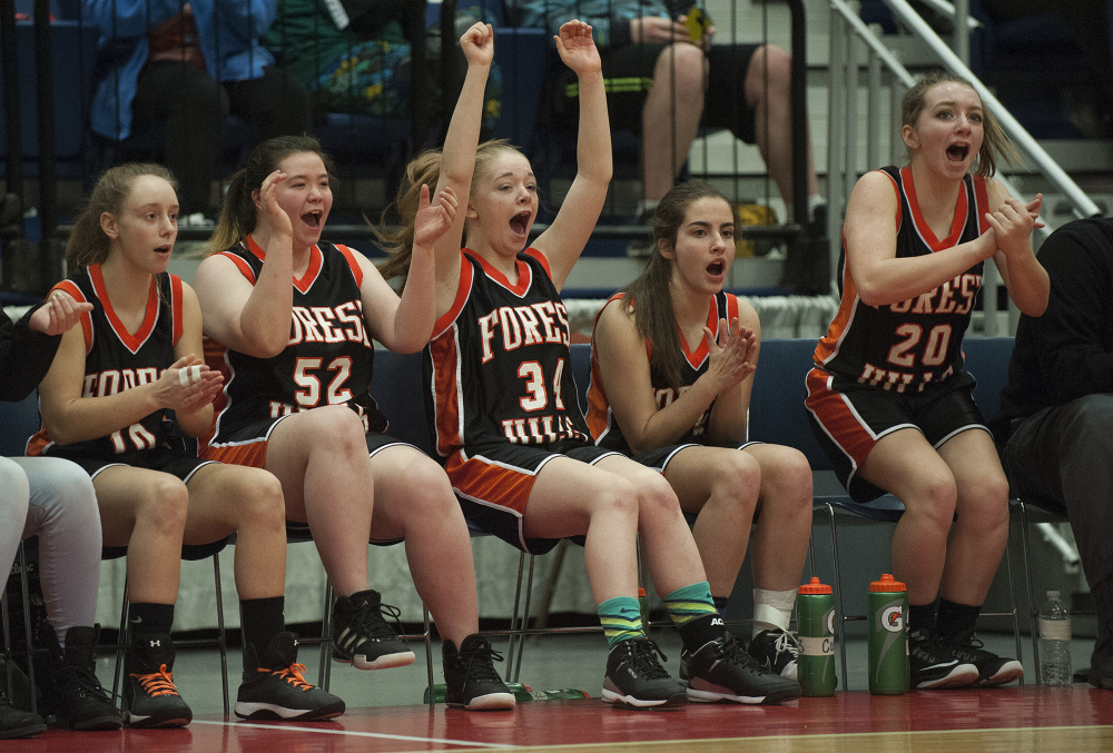 Members of the Forest Hills girls basketball team reacts during a Class D South semifinal against top-seeded Rangeley on Thursday at the Augusta Civic Center. The No. 5 Tigers upset the Lakers.