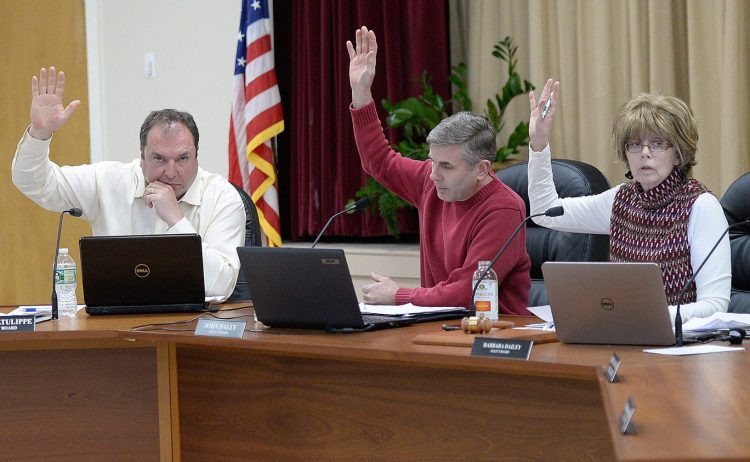 Ogunquit Select Board members, left to right, Gary Latulippe, John Daley and Barbara Dailey vote to accept Town Manager Thomas Fortier's letter of resignation Tuesday night. Board members lashed out at residents and one another during the meeting.