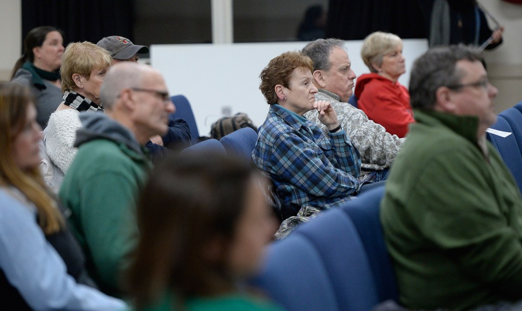 Residents at Tuesday night's meeting listen as the Ogunquit Select Board accepts Town Manager Thomas Fortier's letter of resignation. Some said the board should have fired Fortier.