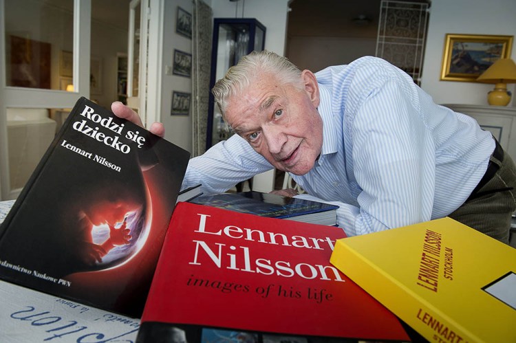 Photographer Lennart Nilsson poses with some of his books in 2012. 
Nilsson died Saturday.