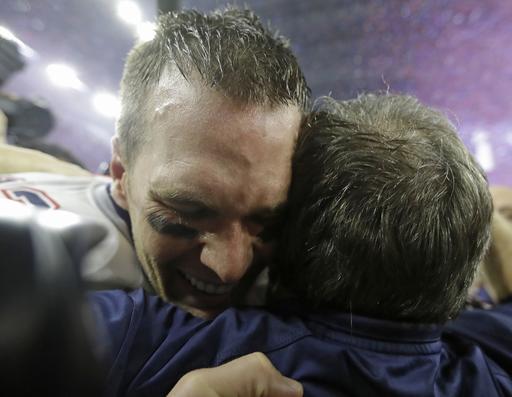 Tom Brady celebrates with Coach Bill Belichick after winning the Super Bowl in dramatic fashion Sunday.   David J. Phillip/Associated Press