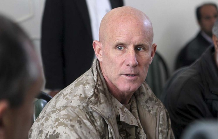 In this image provided by the U.S. Marine Corps, Vice Adm. Robert S. Harward, commanding officer of Combined Joint Interagency Task Force 435, speaks to an Afghan official during his visit to Zaranj, Afghanistan, in 2011. 