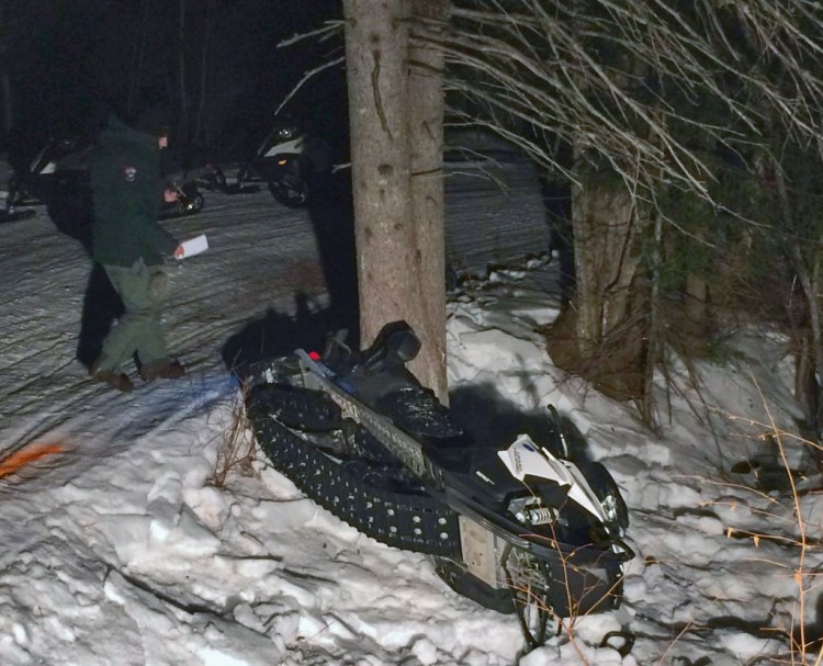 The Maine Warden Service released this photo of a snowmobile crash in Eustis on Sunday that resulted in the death of Dennis Picard of Massachusetts.