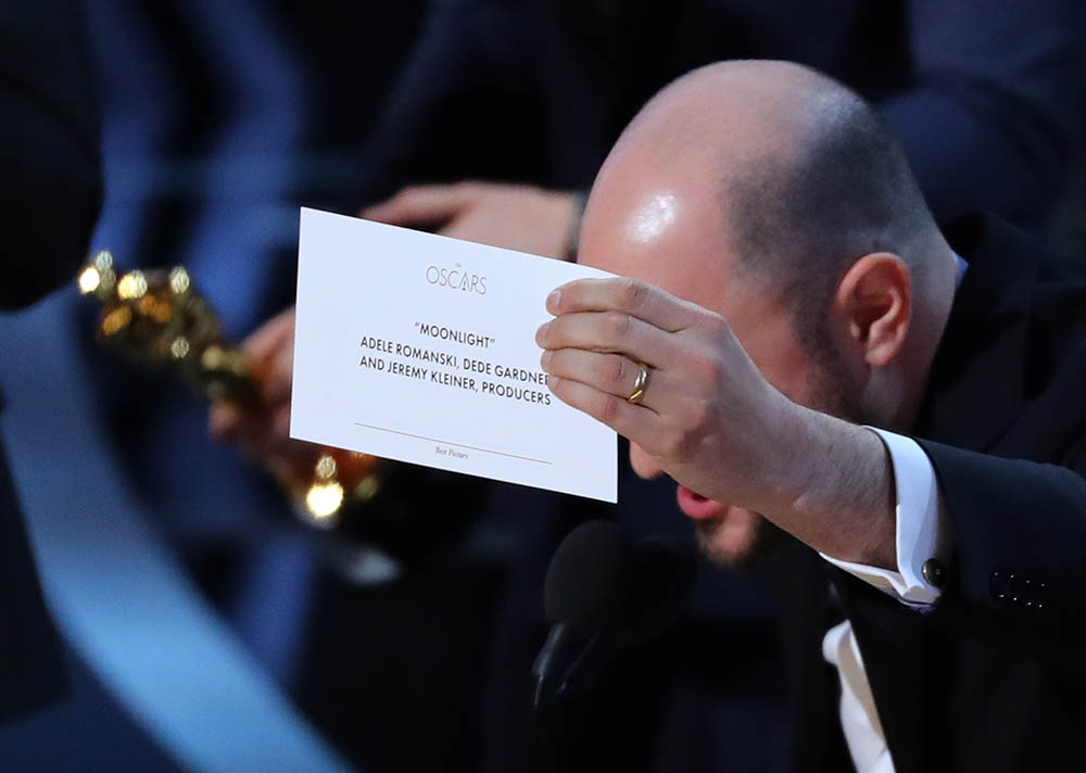 Producer Jordon Horowitz holds up the card for the Best Picture winner "Moonlight." 