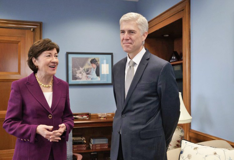 Supreme Court Justice nominee Neil Gorsuch meets with Senate Judiciary Committee member Sen. Susan Collins, R-Maine, on Capitol Hill in Washington on Thursday. The committee will oversee Gorsuch's confirmation hearing. 