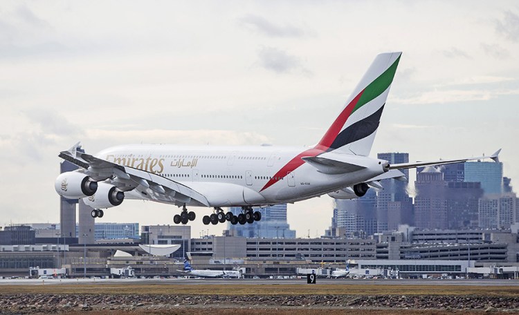 An Emirates plane lands at Logan International Airport in Boston on Jan. 26, 2017. Flight time from Dubai to Boston is about 14 hours, 15 minutes. Emirates' latest route from Dubai to Auckland clocks in at a whopping 16.5 hours – the lengthiest flight currently on the market.

