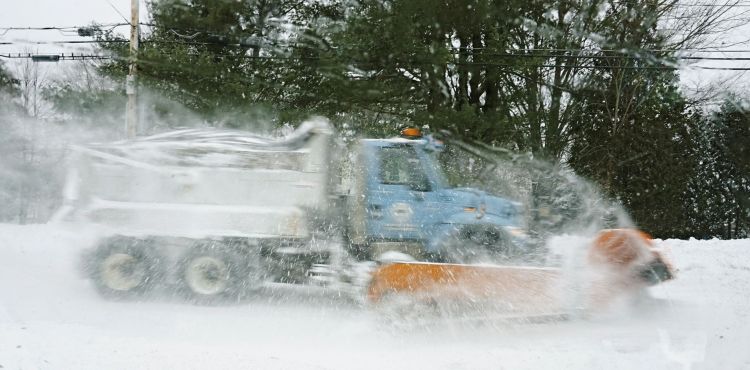 A plow truck clears snow from Fletcher Street in Kennebunk during the storm  Monday morning. The National Weather Service warns that today's storm  will bring the heaviest snow during the afternoon and evening hours, and this evening's commute could be treacherous.
