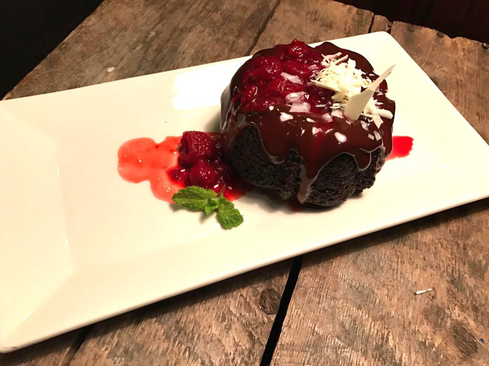 A mini bundt cake drizzled with a raspberry coulis is the vegan dessert choice at Gather during restaurant week.