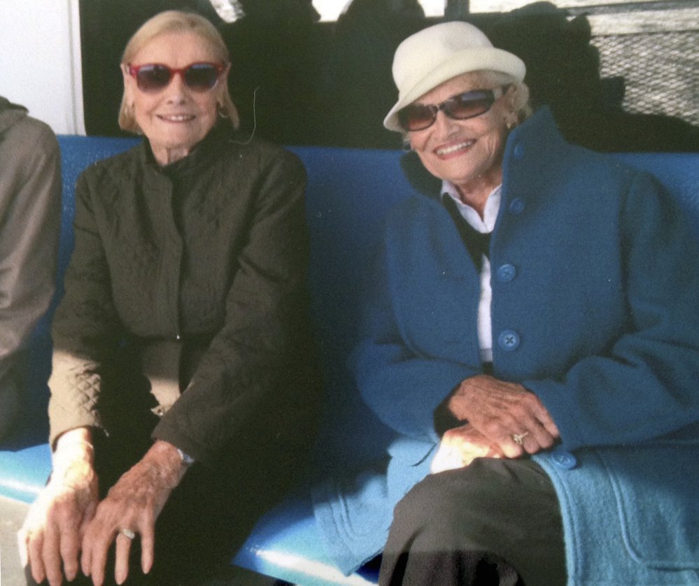 Martha Williams, left, of East Providence, R.I., sits with her twin, Jean Haley of Barrington, R.I., on a ferry en route to the Massachusetts island of Nantucket in 2015.