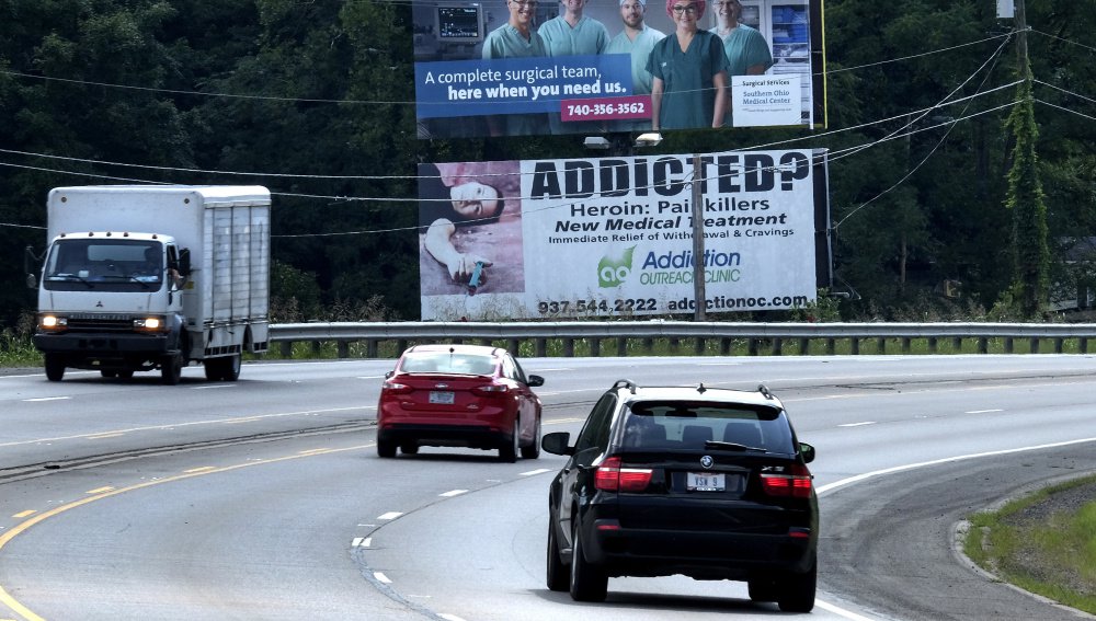 A billboard near Chillicothe, Ohio, advertises help for those addicted to opioids. Ohio is among many states, including Maine, where drug addiction and overdose deaths have skyrocketed in the past decade.