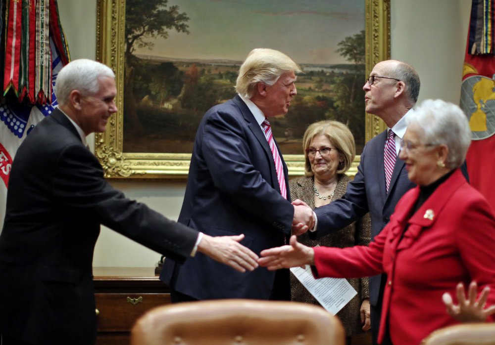 President Trump and Vice President Pence, left, meet Friday with key House committee members at the White House.