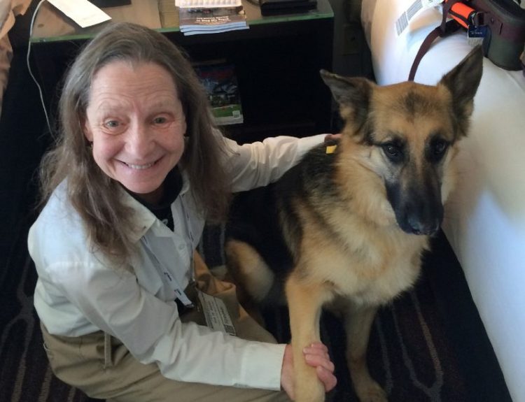 Sue Martin and her guide dog, Quan, who were kicked off an American Airlines flight this month. "I've never been so humiliated and traumatized," Martin said.