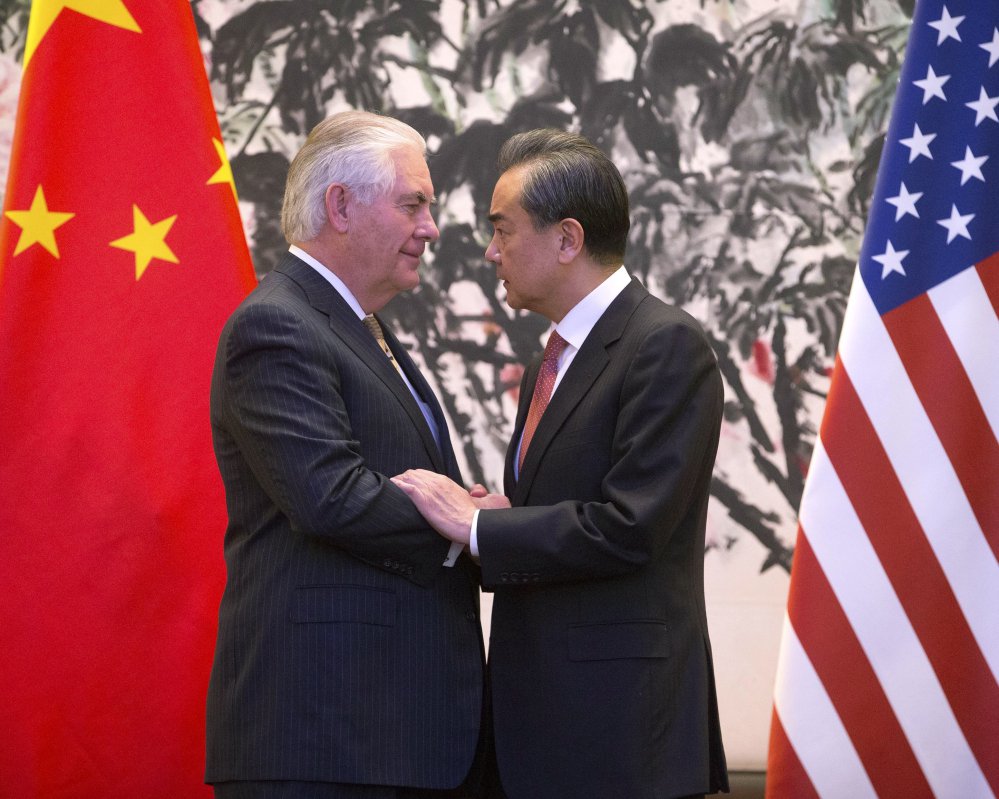 Secretary of State Rex Tillerson and Chinese Foreign Minister Wang Yi end a joint news conference after their meeting on North Korea in Beijing on Saturday.