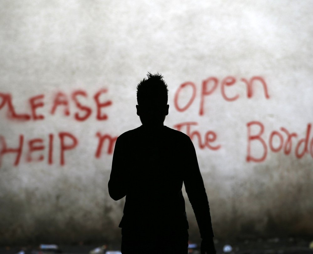 A migrant walks through an abandoned warehouse in Belgrade, Serbia, serving as a makeshift shelter for hundreds trying to reach Western Europe on Tuesday. Thousands of migrants have been stranded in Serbia.