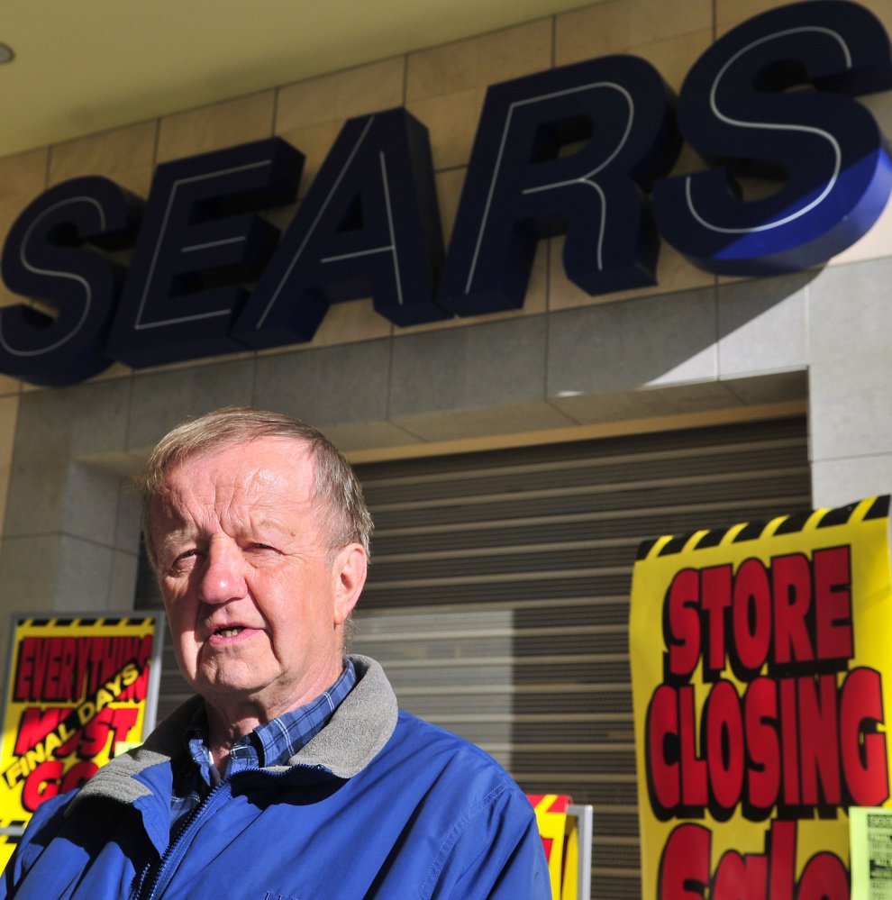 Former Sears employee Cal Brown stands in front of the Augusta Sears that, like so many others of its kind, will soon close as modern shopping trends online and elsewhere.