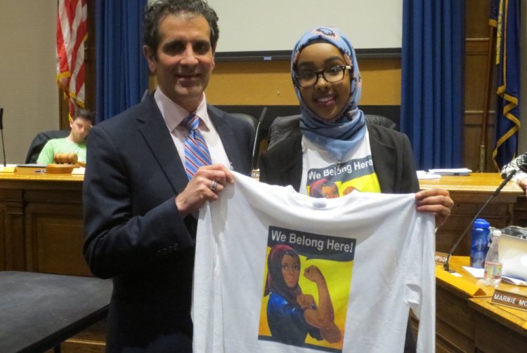 Superintendent Xavier Botana and Portland High School senior Zahra Abukar hold up one of the new Rosie the Riveter-style T-shirts.