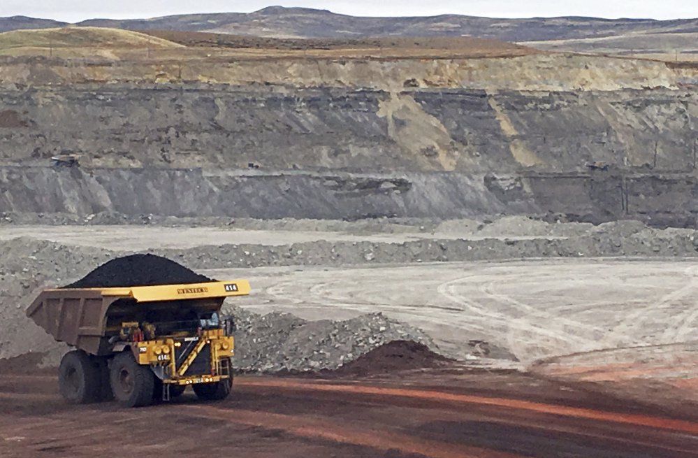 A truck hauls away a load of coal Tuesday at Contura Energy's Eagle Butte Mine near Gillette, Wyo.