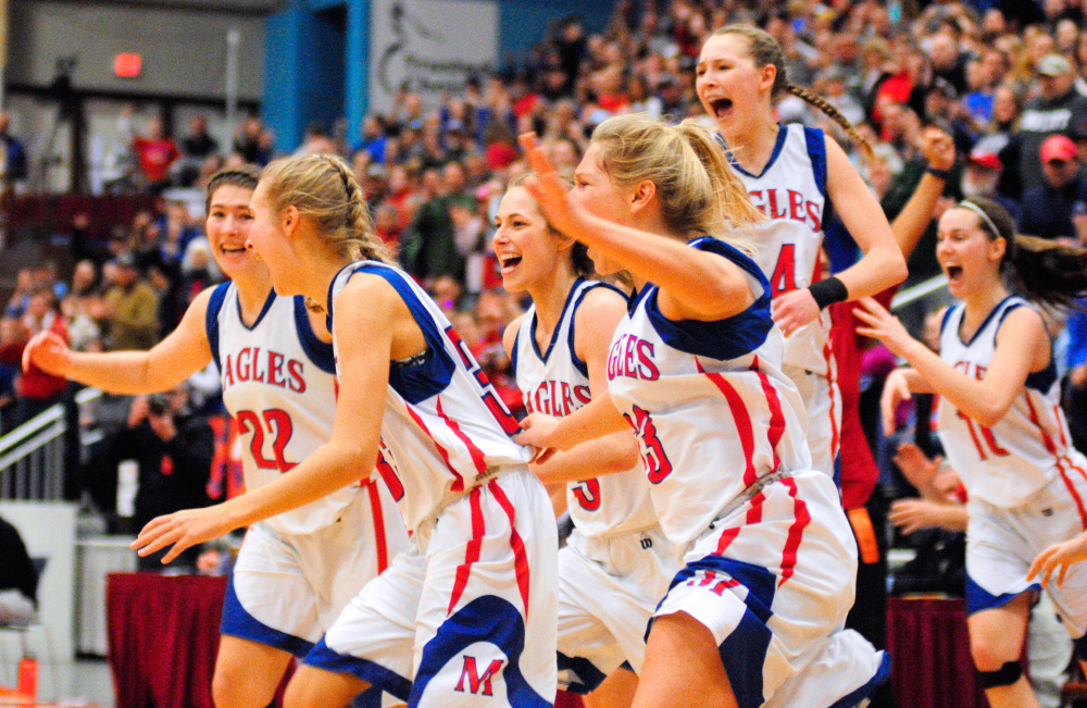 Messalonskee players run out onto court at conclusion of the Class A state championshp Saturday at the Augusta Civic Center. The Eagles beat Brunswick.