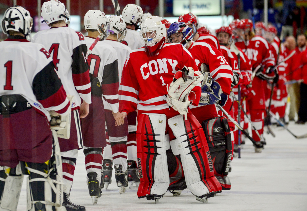 Cony goalie Dalton Bowie leads his team to congratulate Bangor in their 2-1 win in the Class A North semifinals Saturday in Lewiston.