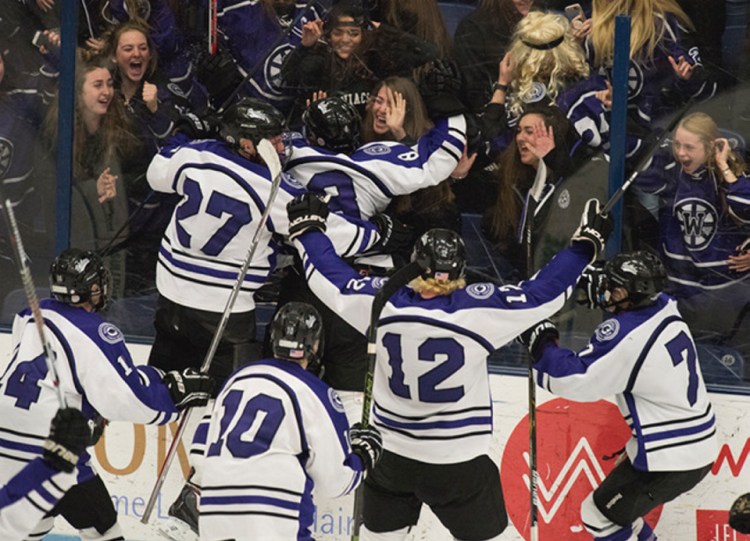 Kevin Bennett photo 
 Waterville celebrates its win over Old Town/Orono in the Class B Noth regional final Tuesday night in Orono.