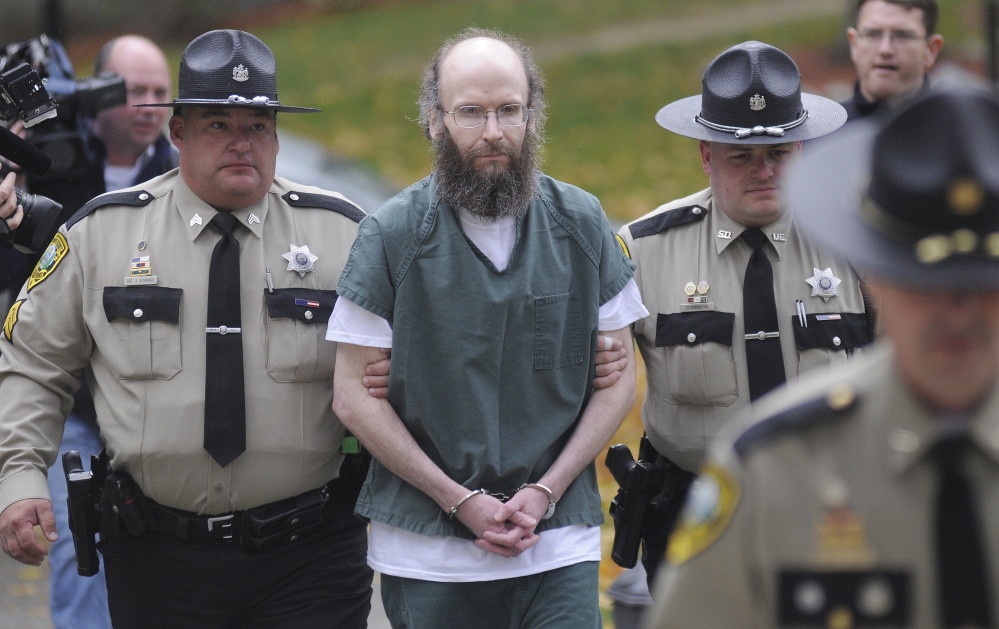 Christopher Knight is escorted in October 2013 into Kennebec County Superior Court in Augusta to enter pleas for multiple charges of burglary and theft while living in the woods of Rome.