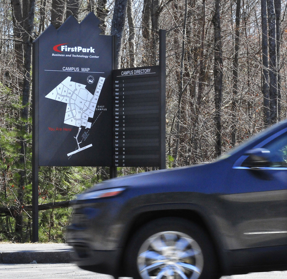 A driver passes a FirstPark directory sign on April 14, 2016, at the business facility in Oakland.